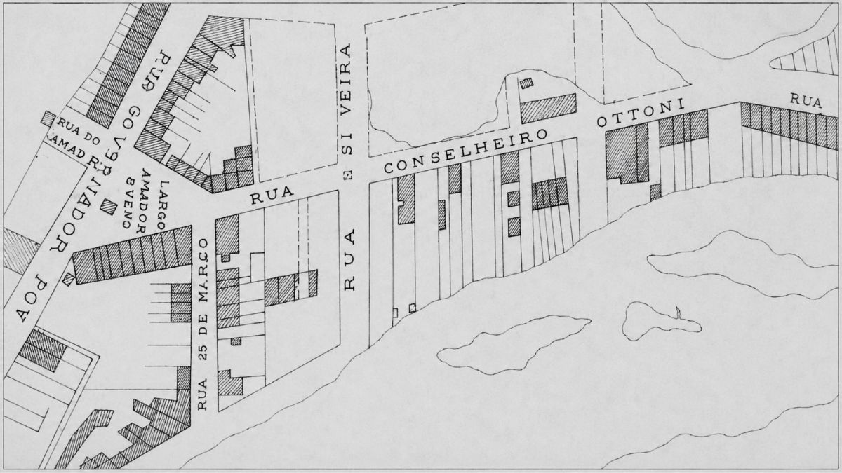 Mapa técnico histórico em preto e branco detalhando quarteirões edificados e as margens do rio.